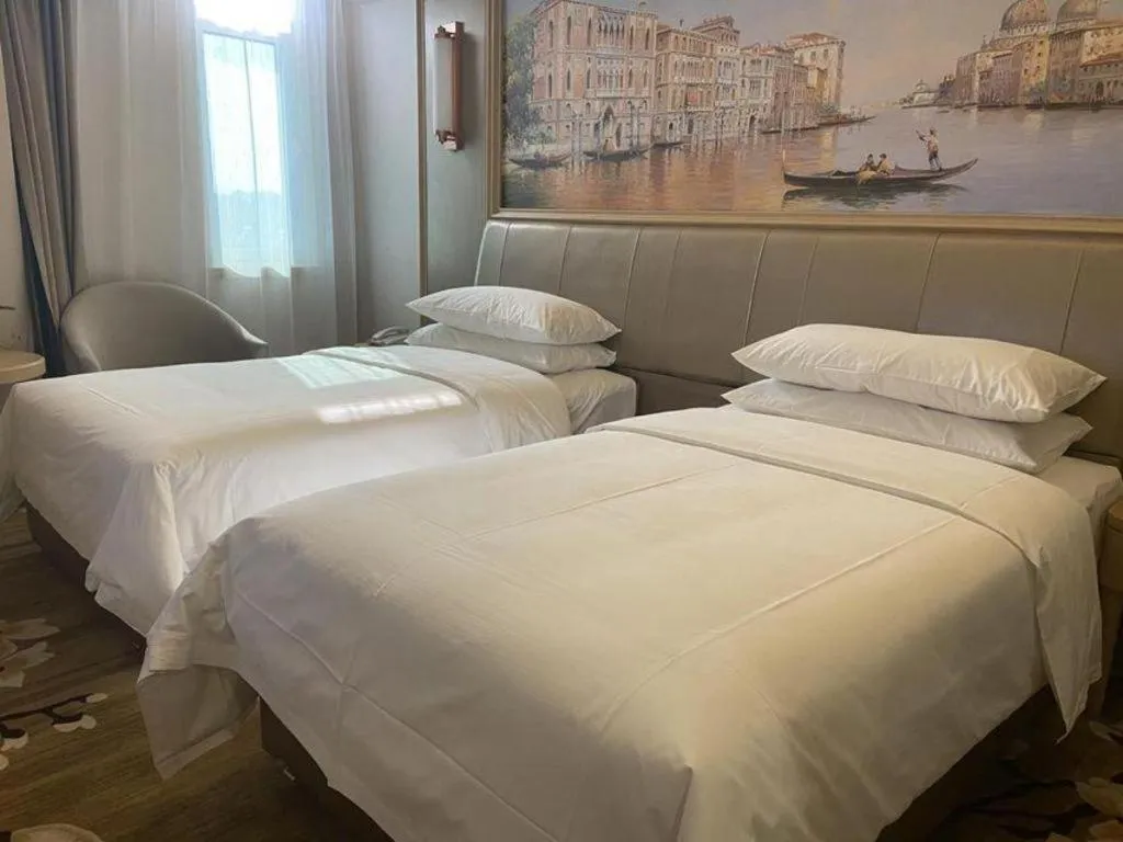 Bed in Vienna Hotel Shandong Qingdao Jiaodong International Airport Hai'er Avenue