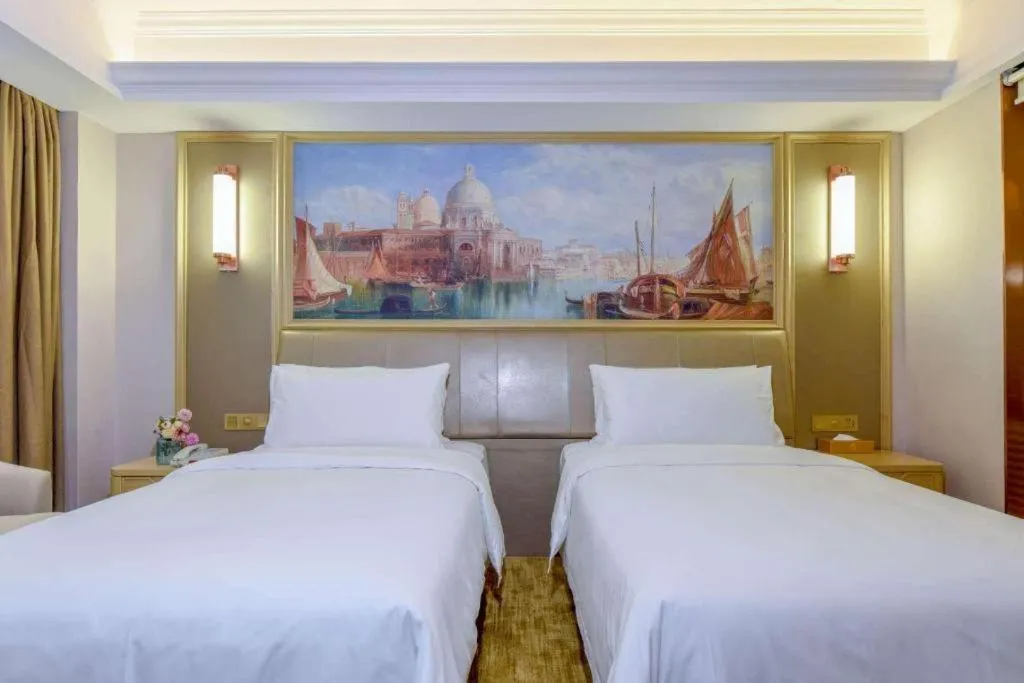 Bed in Vienna Hotel Shandong Qingdao Jiaodong International Airport Hai'er Avenue