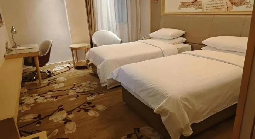 Bed in Vienna Hotel Shandong Qingdao Jiaodong International Airport Hai'er Avenue