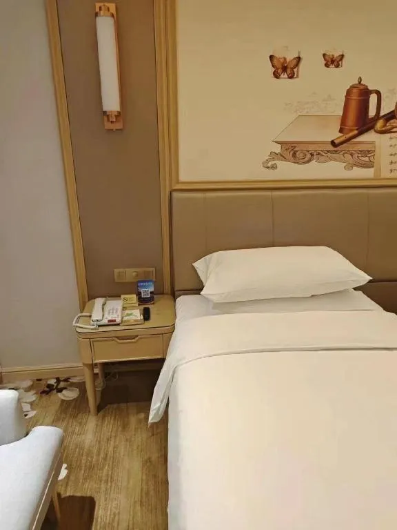 Bed in Vienna Hotel Shandong Qingdao Jiaodong International Airport Hai'er Avenue