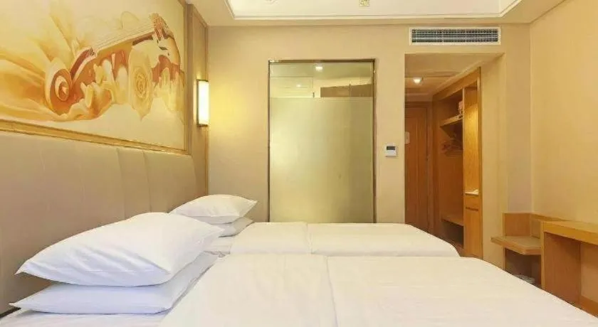 Bed in Vienna Hotel Zhengzhou Fengchan Road Fortune Plaza