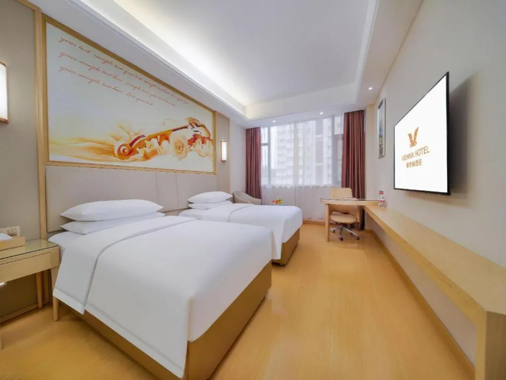 Bed in Vienna Hotel Zhengzhou Fengchan Road Fortune Plaza