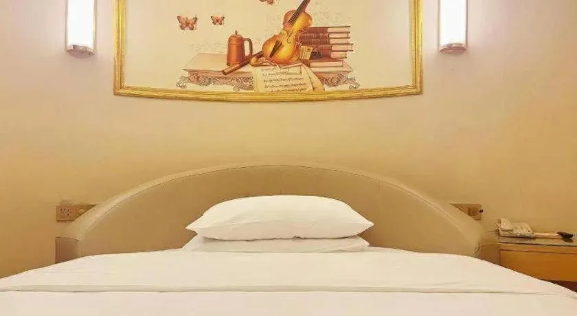 Bed in Vienna Hotel Zhengzhou Fengchan Road Fortune Plaza