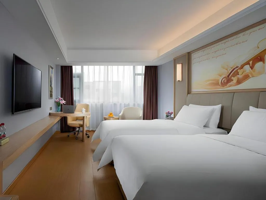 Bed in Vienna Hotel Zhengzhou Fengchan Road Fortune Plaza