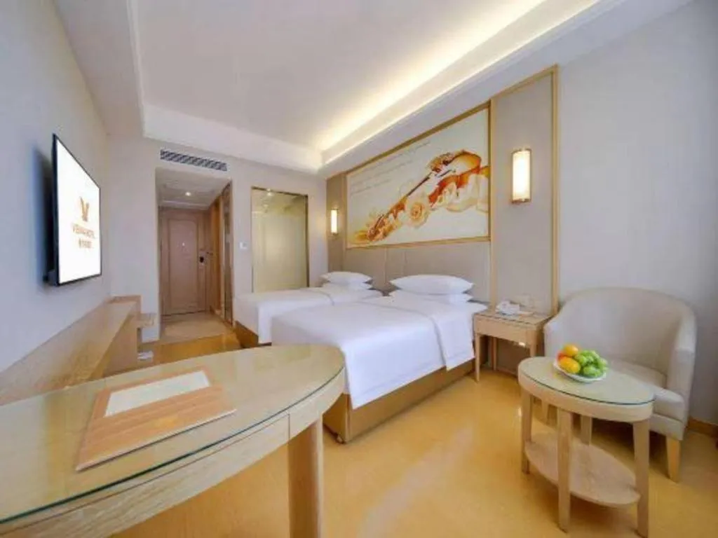Bed in Vienna Hotel Zhengzhou Fengchan Road Fortune Plaza