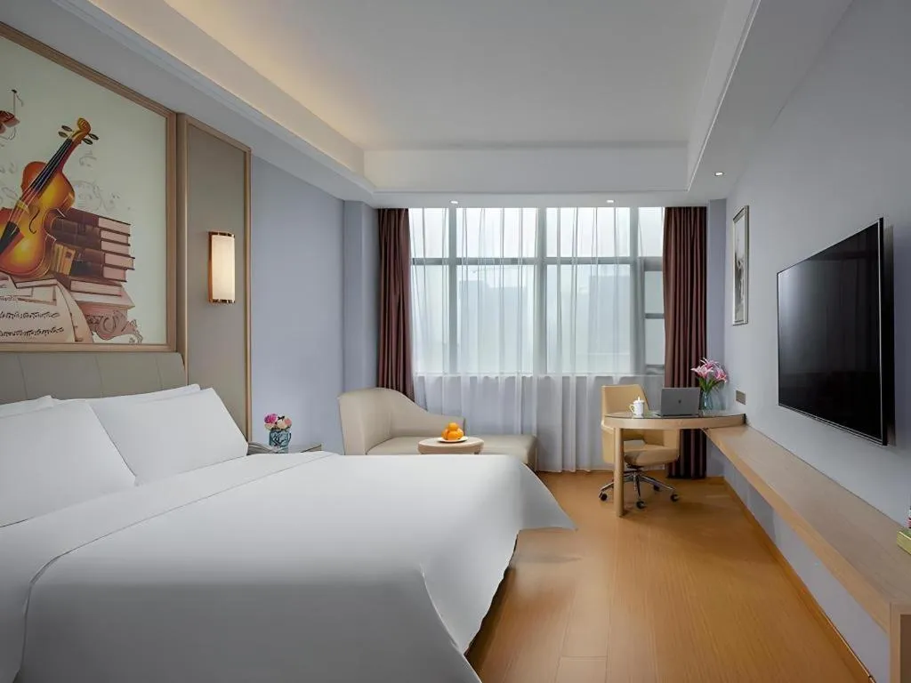 Bed in Vienna Hotel Zhengzhou Fengchan Road Fortune Plaza