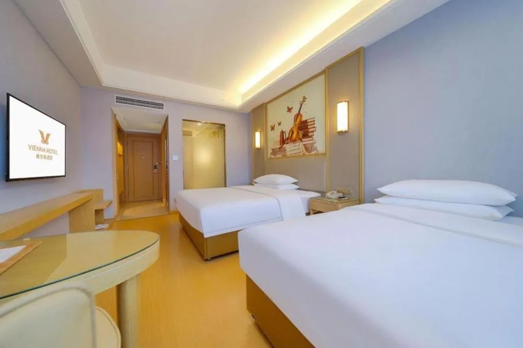 Bed in Vienna Hotel Zhengzhou Fengchan Road Fortune Plaza