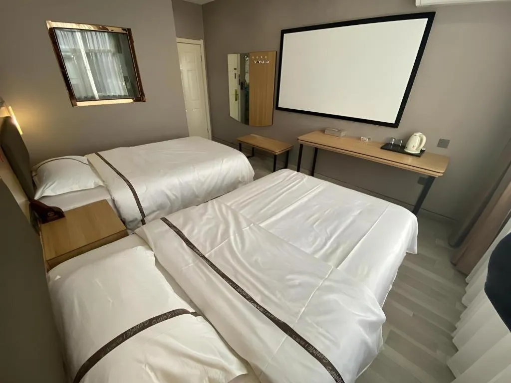 Bed in Jun Light Hotel Jiangxi Jiujiang Yongxiu County Dongyong Mall