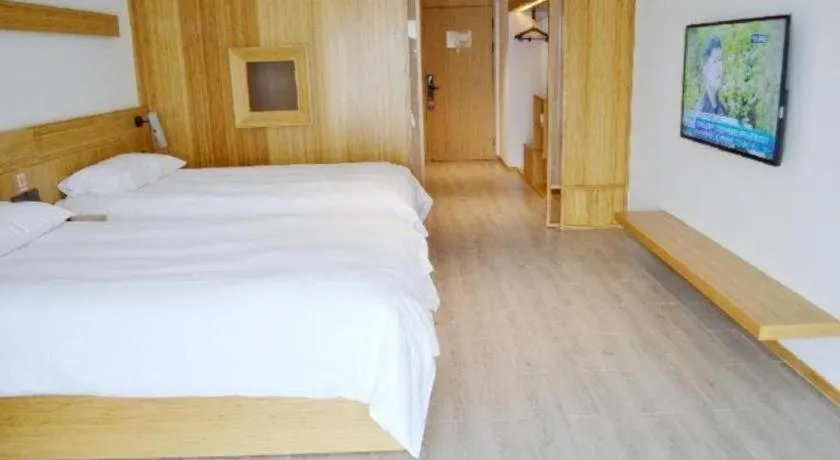 Bed in Meijin All Suites Hotel Suzhou