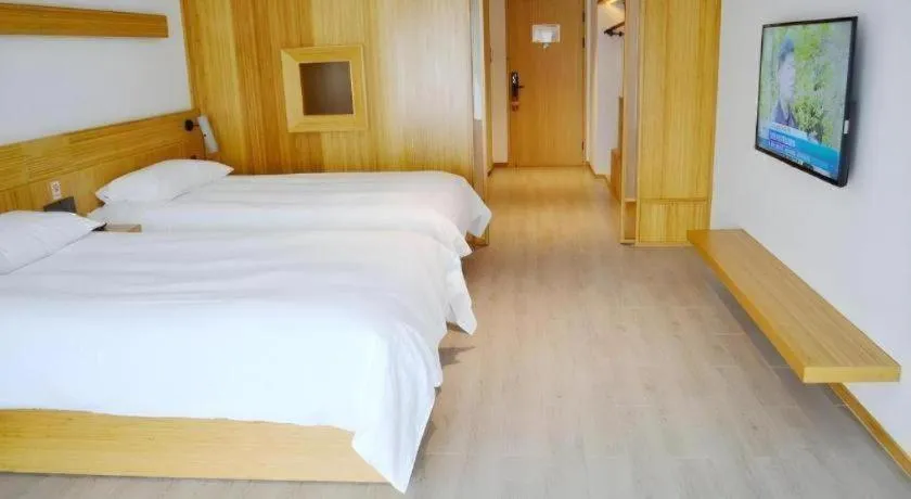 Bed in Meijin All Suites Hotel Suzhou