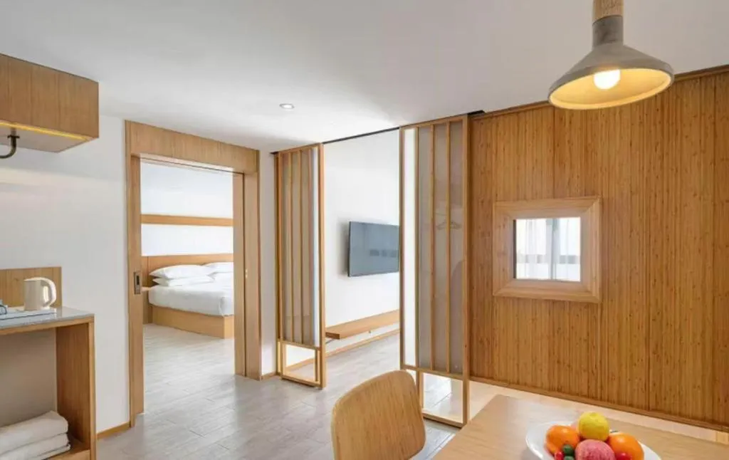 Bed in Meijin All Suites Hotel Suzhou