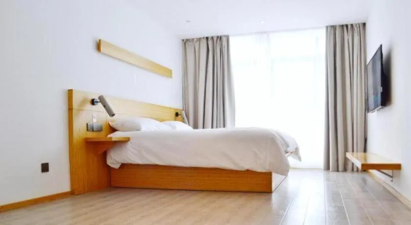 Bed in Meijin All Suites Hotel Suzhou