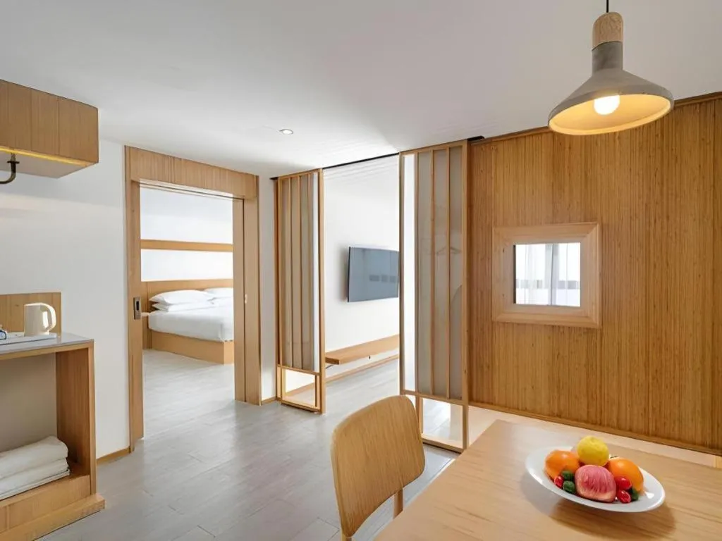 Bed in Meijin All Suites Hotel Suzhou