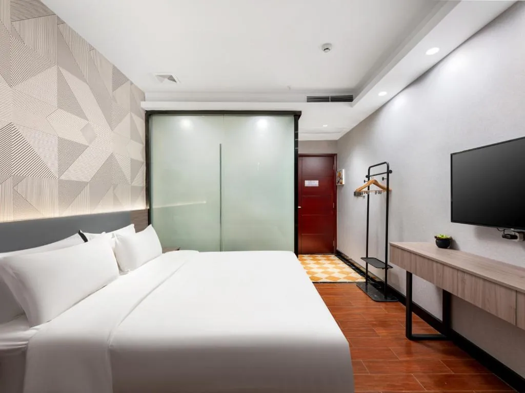 Bed in Borrman Hotel Huizhou Danshui High-speed Railway Huiyang Station