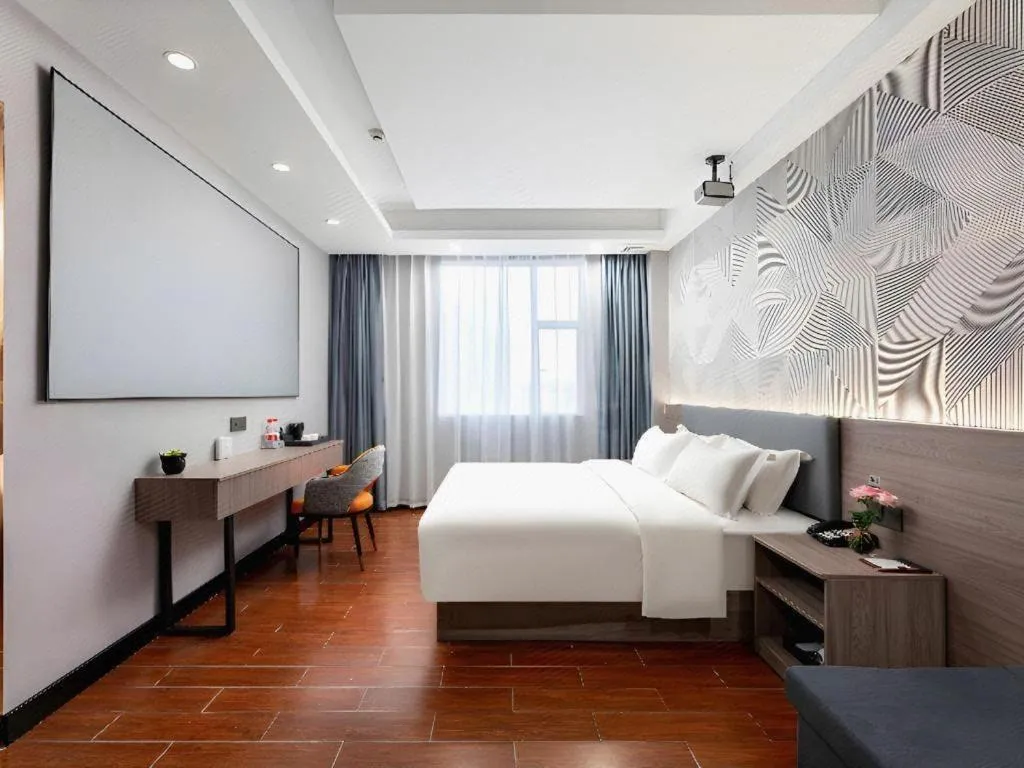 Bed in Borrman Hotel Huizhou Danshui High-speed Railway Huiyang Station