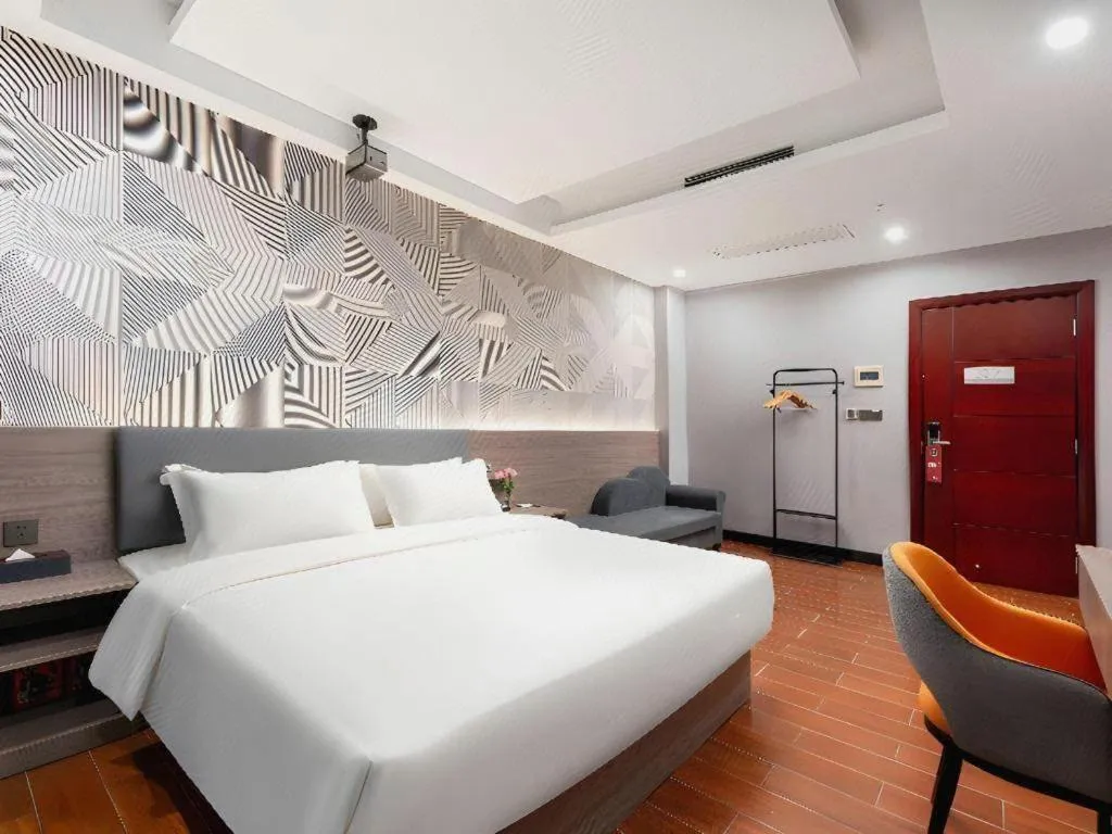 Bed in Borrman Hotel Huizhou Danshui High-speed Railway Huiyang Station