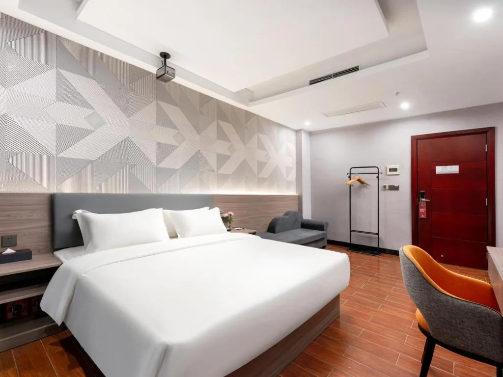 Bed in Borrman Hotel Huizhou Danshui High-speed Railway Huiyang Station