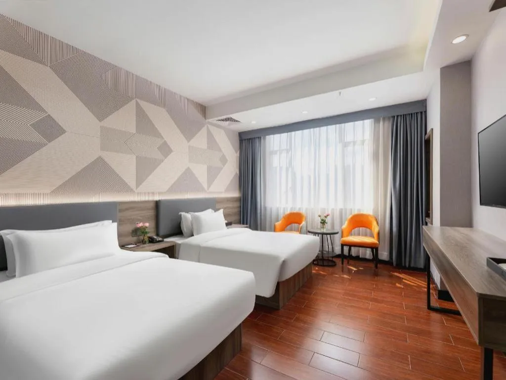 Bed in Borrman Hotel Huizhou Danshui High-speed Railway Huiyang Station