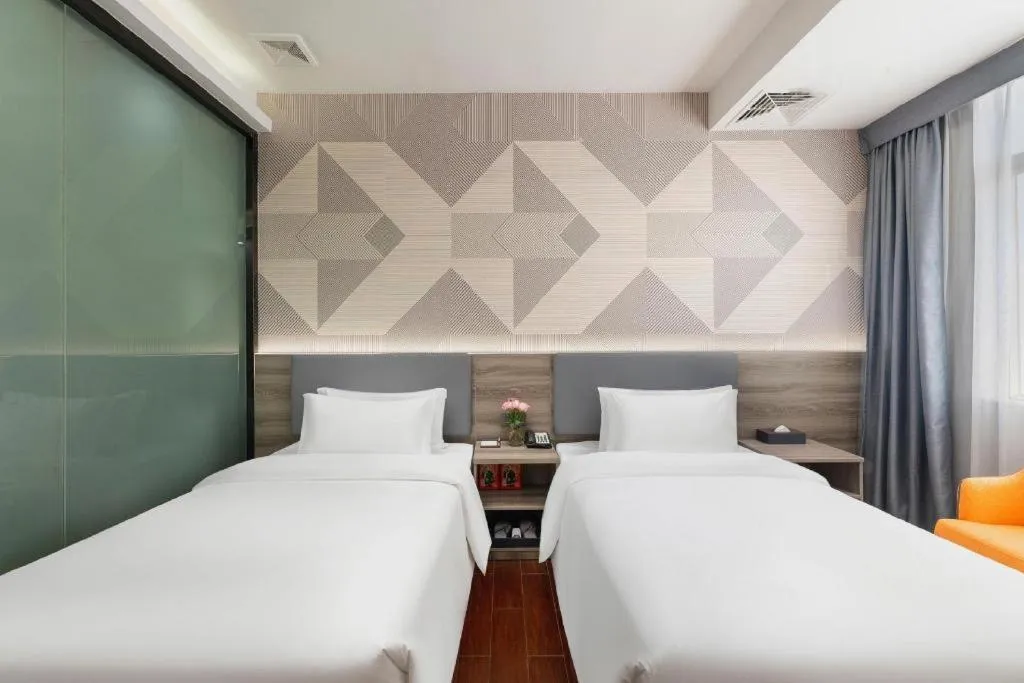 Bed in Borrman Hotel Huizhou Danshui High-speed Railway Huiyang Station