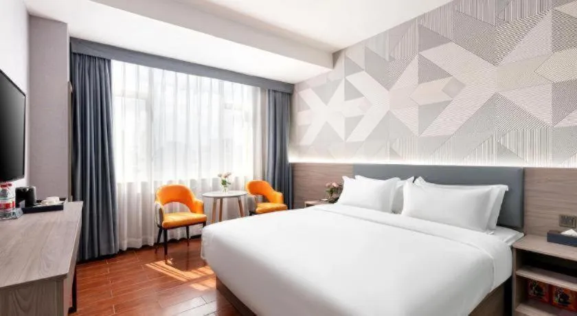 Bed in Borrman Hotel Huizhou Danshui High-speed Railway Huiyang Station