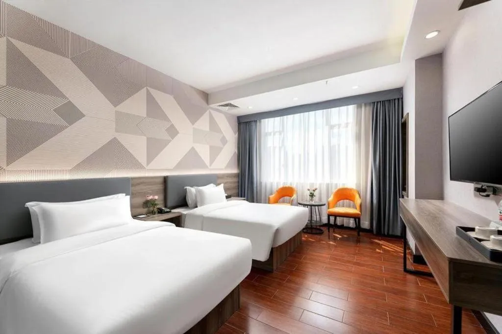 Bed in Borrman Hotel Huizhou Danshui High-speed Railway Huiyang Station