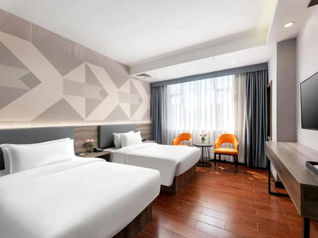 Bed in Borrman Hotel Huizhou Danshui High-speed Railway Huiyang Station