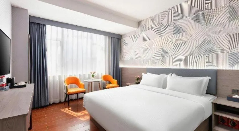 Bed in Borrman Hotel Huizhou Danshui High-speed Railway Huiyang Station