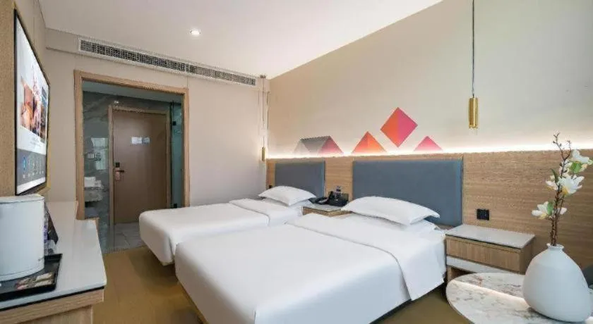 Bed in Borrman Hotel South Beijing Railway Station Caoqiao Station