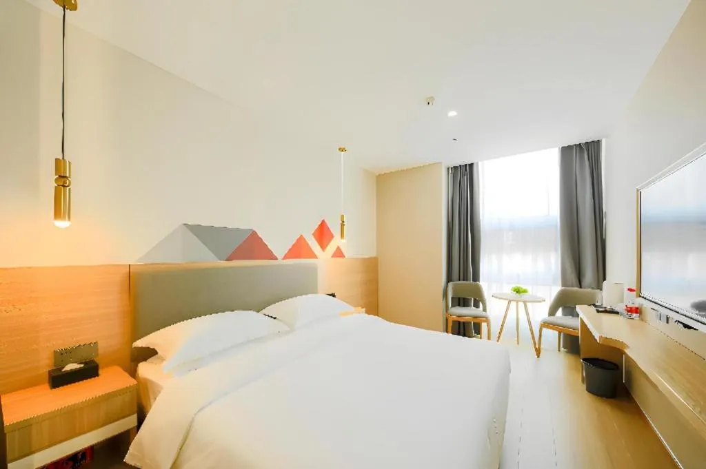 Bed in Borrman Hotel South Beijing Railway Station Caoqiao Station