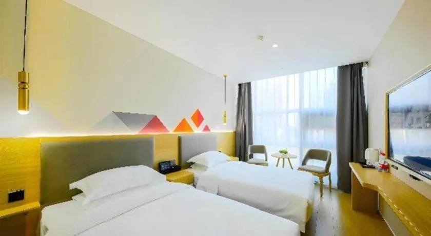 Bed in Borrman Hotel South Beijing Railway Station Caoqiao Station