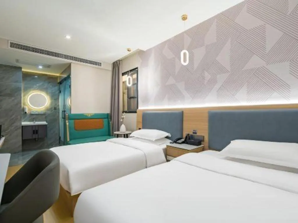 Bed in Borrman Hotel South Beijing Railway Station Caoqiao Station