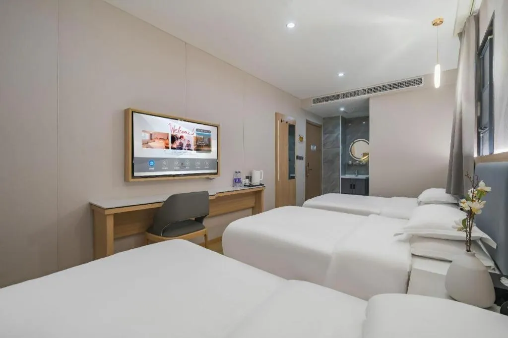 Bed in Borrman Hotel South Beijing Railway Station Caoqiao Station