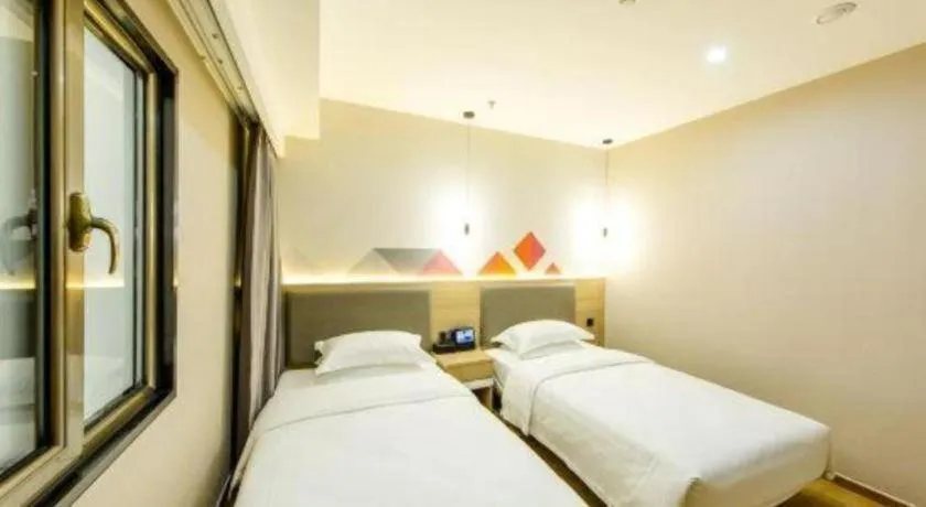 Bed in Borrman Hotel South Beijing Railway Station Caoqiao Station