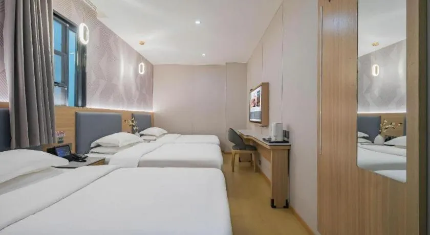 Bed in Borrman Hotel South Beijing Railway Station Caoqiao Station