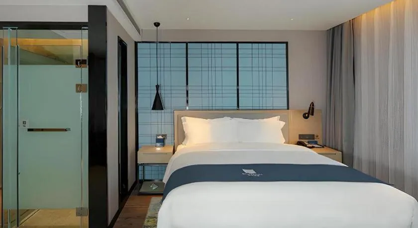 Bed in Echarm Hotel Chengdu Global Center Century City New Exhibition