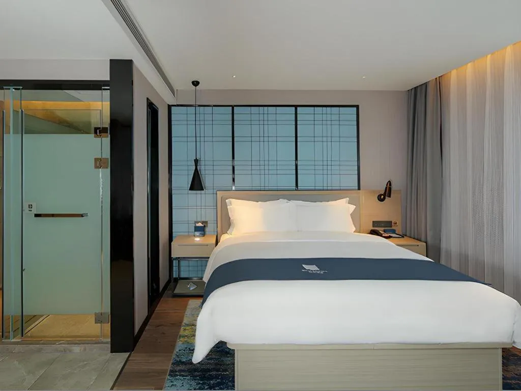 Bed in Echarm Hotel Chengdu Global Center Century City New Exhibition