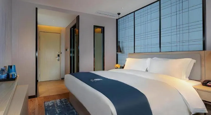 Bed in Echarm Hotel Chengdu Global Center Century City New Exhibition
