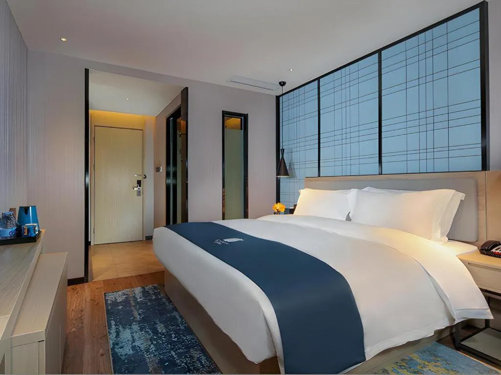 Bed in Echarm Hotel Chengdu Global Center Century City New Exhibition