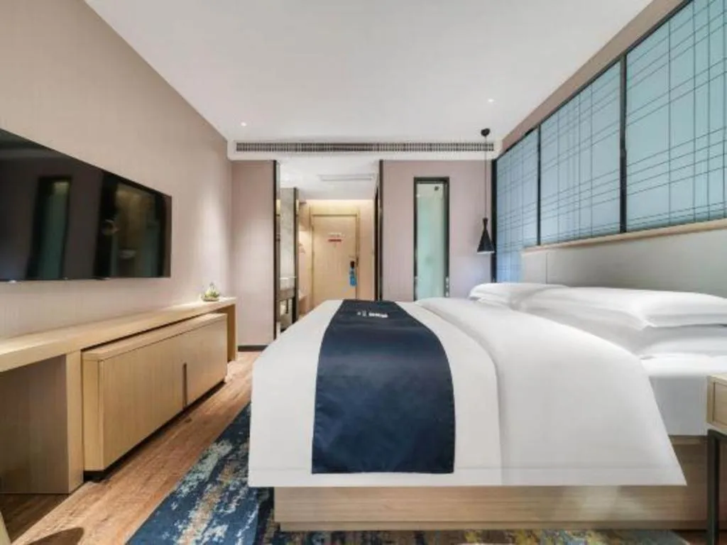Bed in Echarm Hotel Chengdu Global Center Century City New Exhibition
