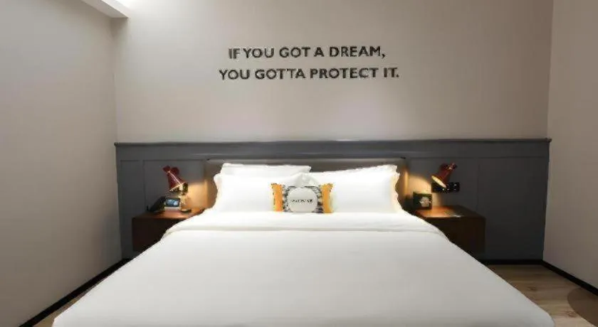 Bed in Premier City Comfort Hotel Hechi Luocheng Central Plaza