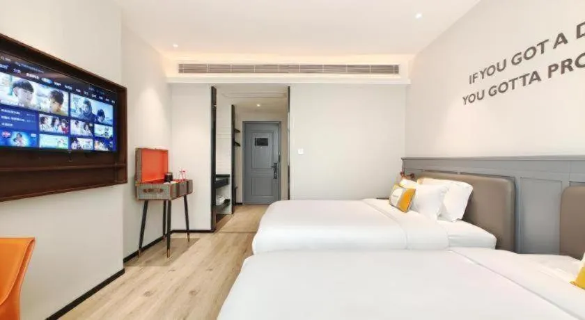 Bed in Premier City Comfort Hotel Hechi Luocheng Central Plaza