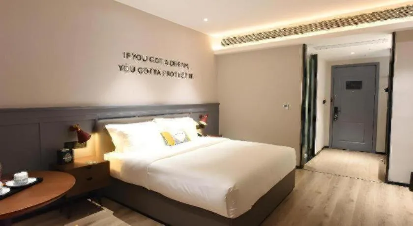 Bed in Premier City Comfort Hotel Hechi Luocheng Central Plaza