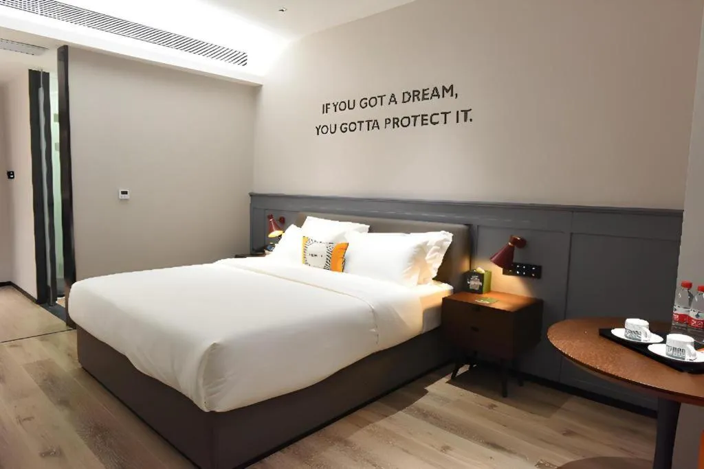 Bed in Premier City Comfort Hotel Hechi Luocheng Central Plaza