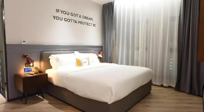 Bed in Premier City Comfort Hotel Hechi Luocheng Central Plaza