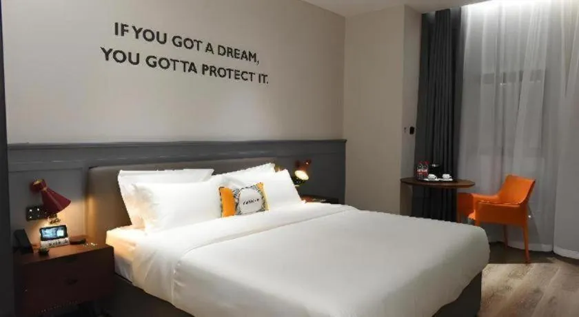 Bed in Premier City Comfort Hotel Hechi Luocheng Central Plaza