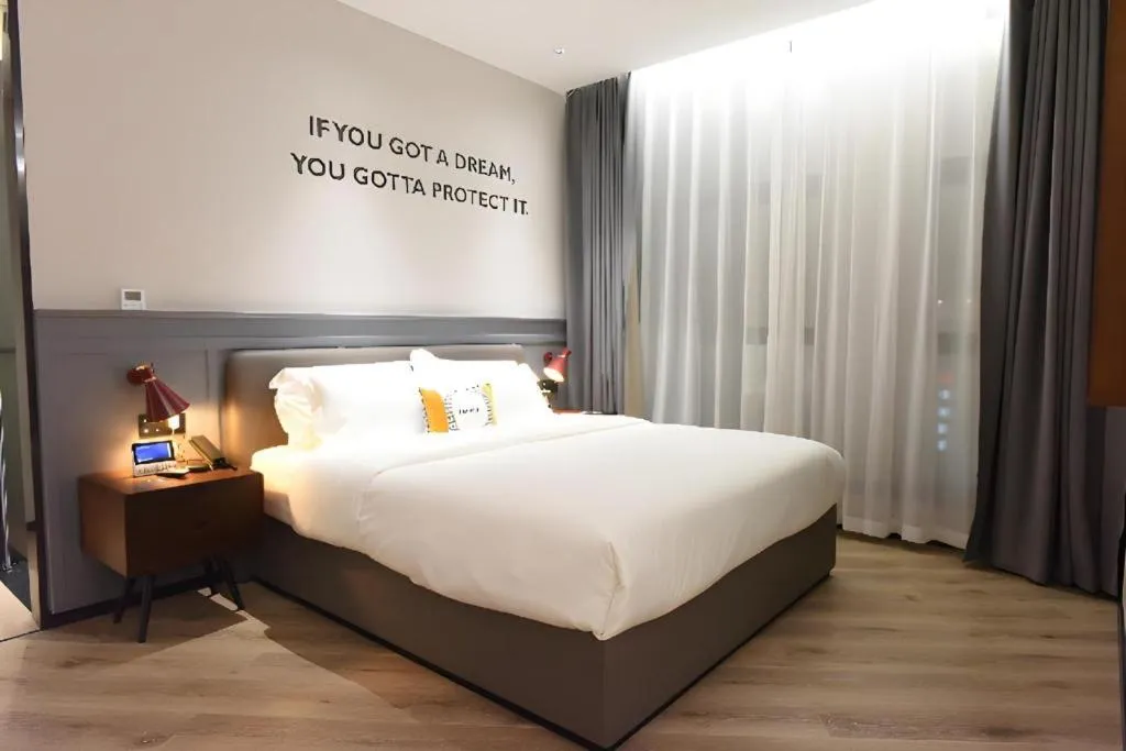 Bed in Premier City Comfort Hotel Hechi Luocheng Central Plaza