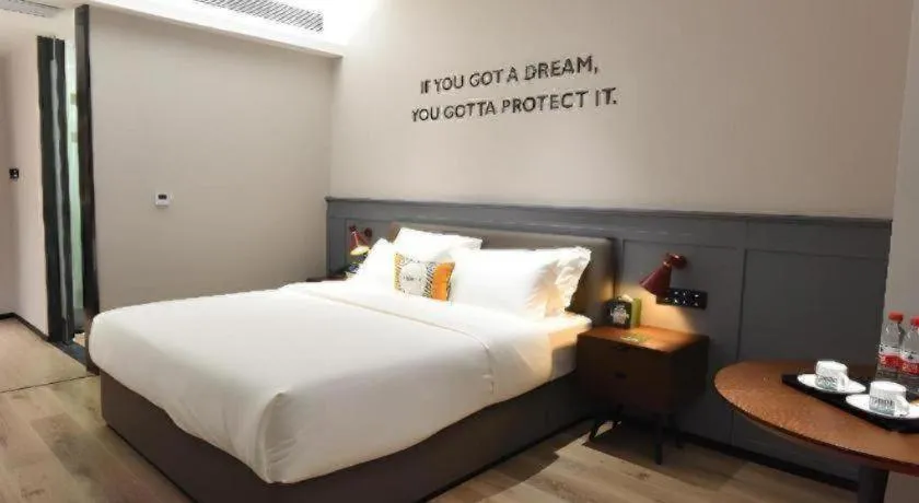 Bed in Premier City Comfort Hotel Hechi Luocheng Central Plaza