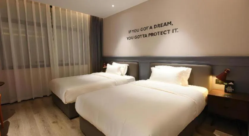 Bed in Premier City Comfort Hotel Hechi Luocheng Central Plaza