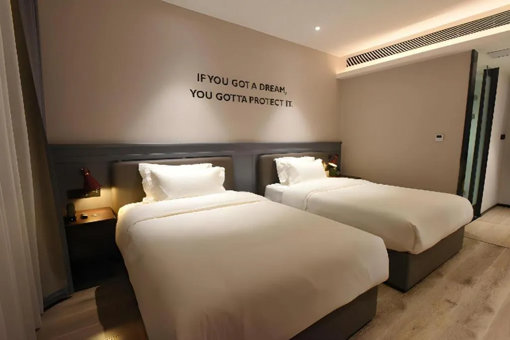 Bed in Premier City Comfort Hotel Hechi Luocheng Central Plaza