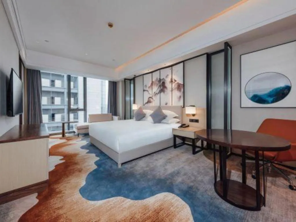 Bed in New Century Grand Hotel Ningbo Zhongdu